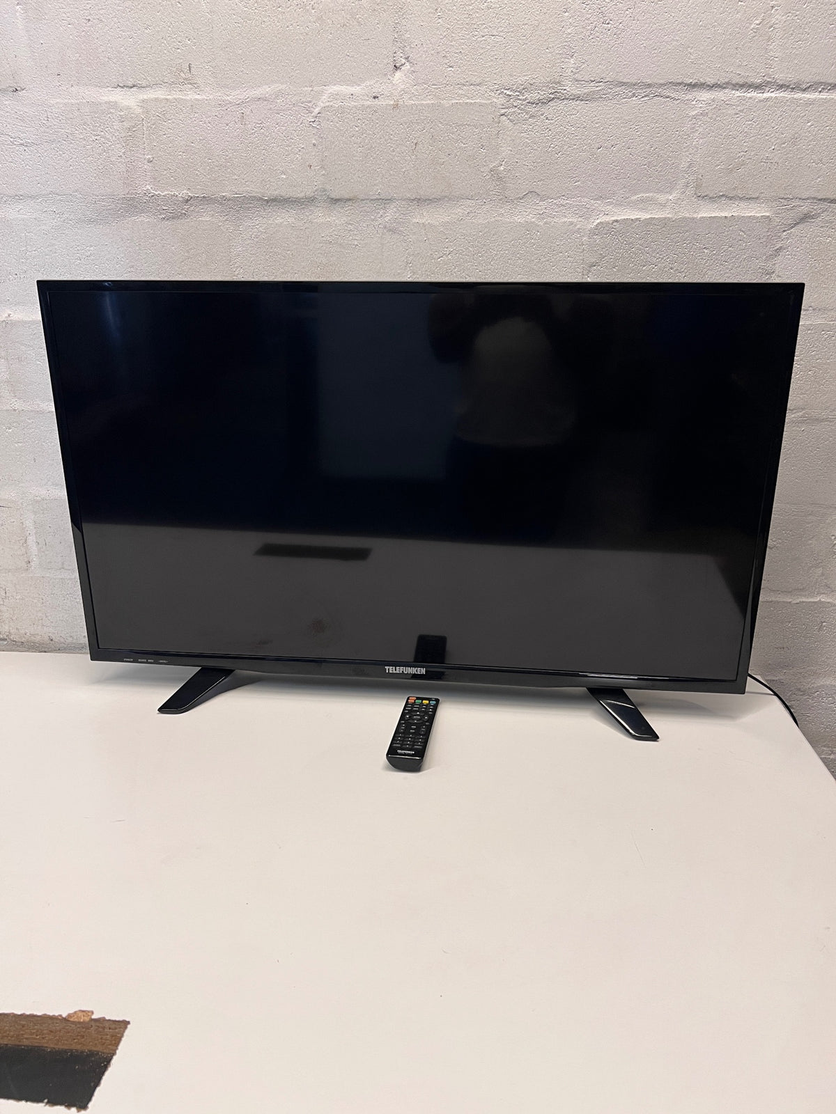 Telefunken Black LCD TV with Remote Control – side view