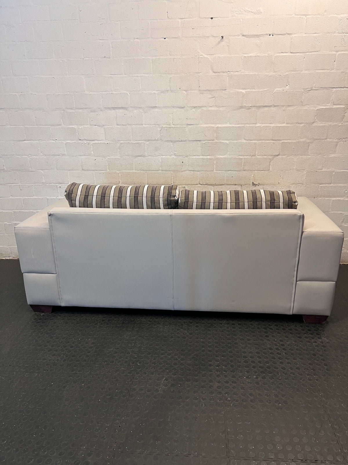 White Two Seater Couch with Striped Fabric Cushions – condition detail
