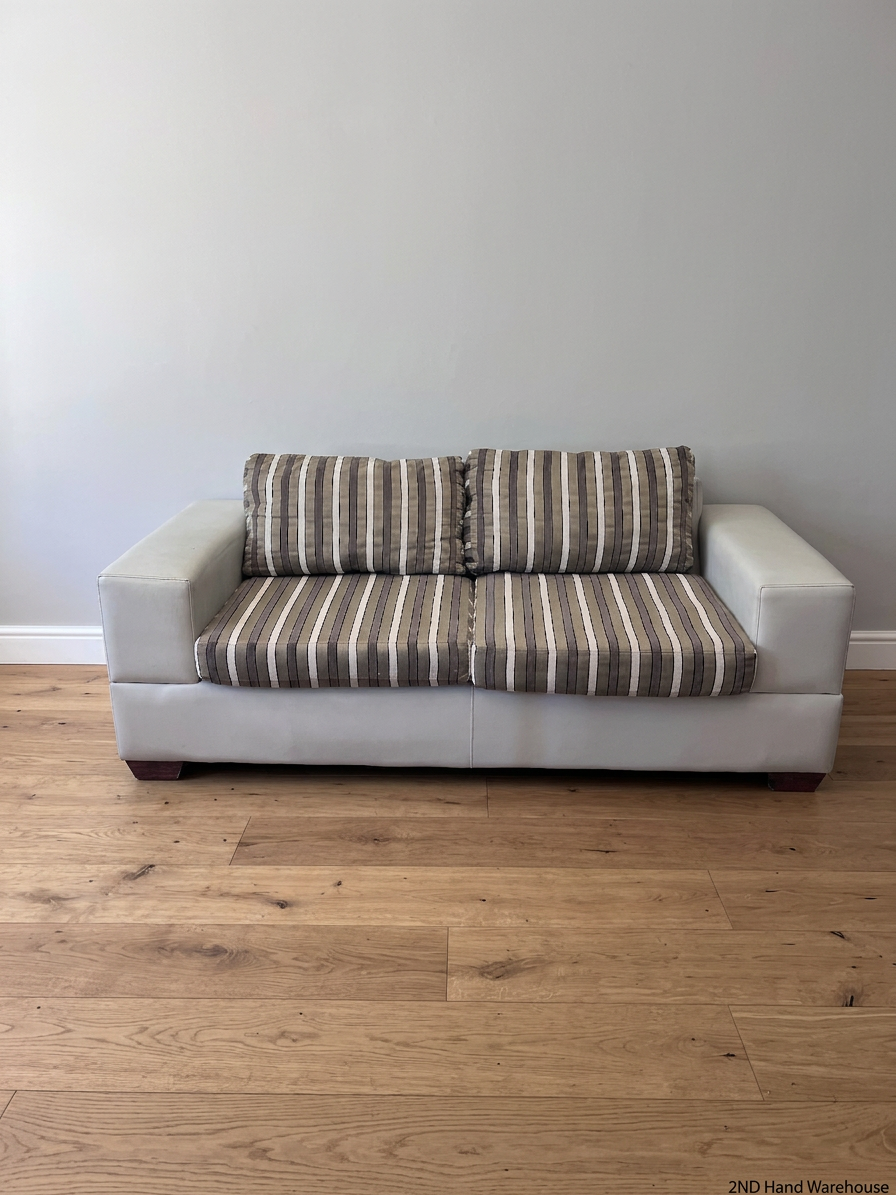 White Two Seater Couch with Striped Fabric Cushions – styled product image