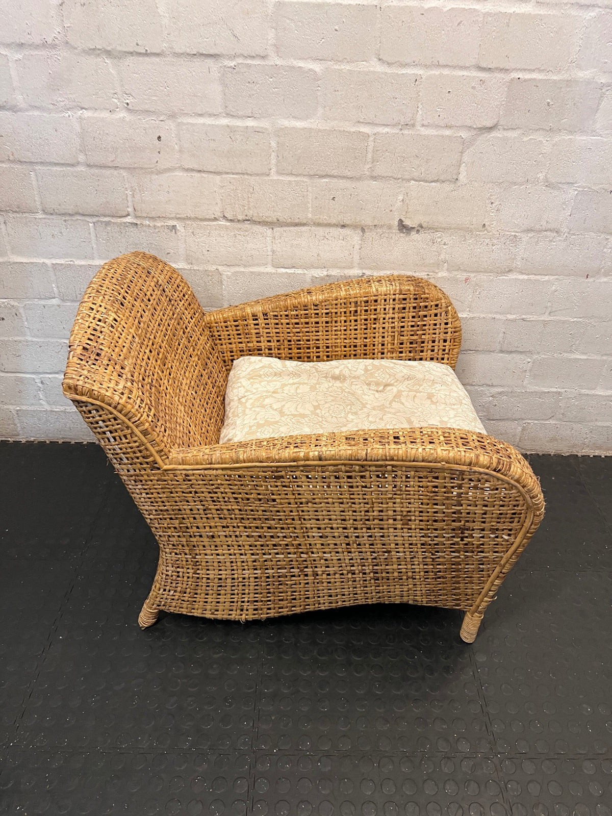 Wicker Armchair with Patterned Cushion – back view