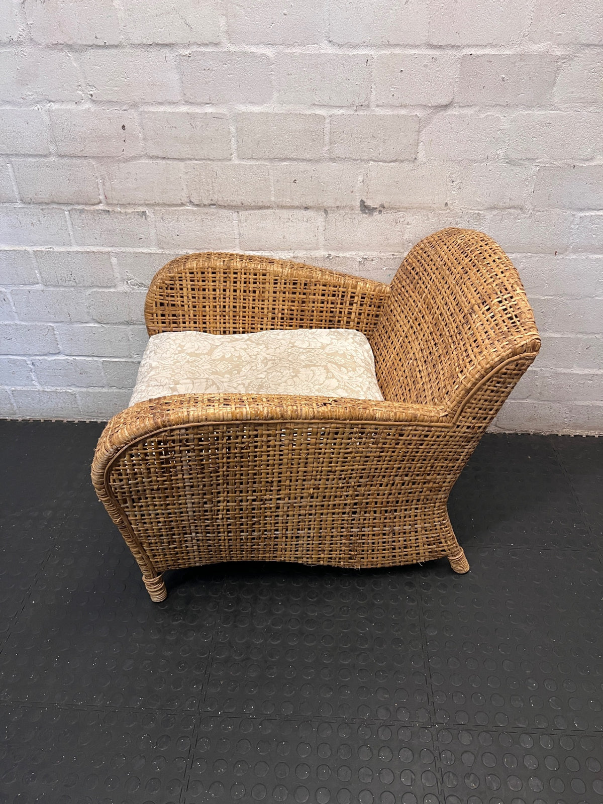 Wicker Armchair with Patterned Cushion – side view