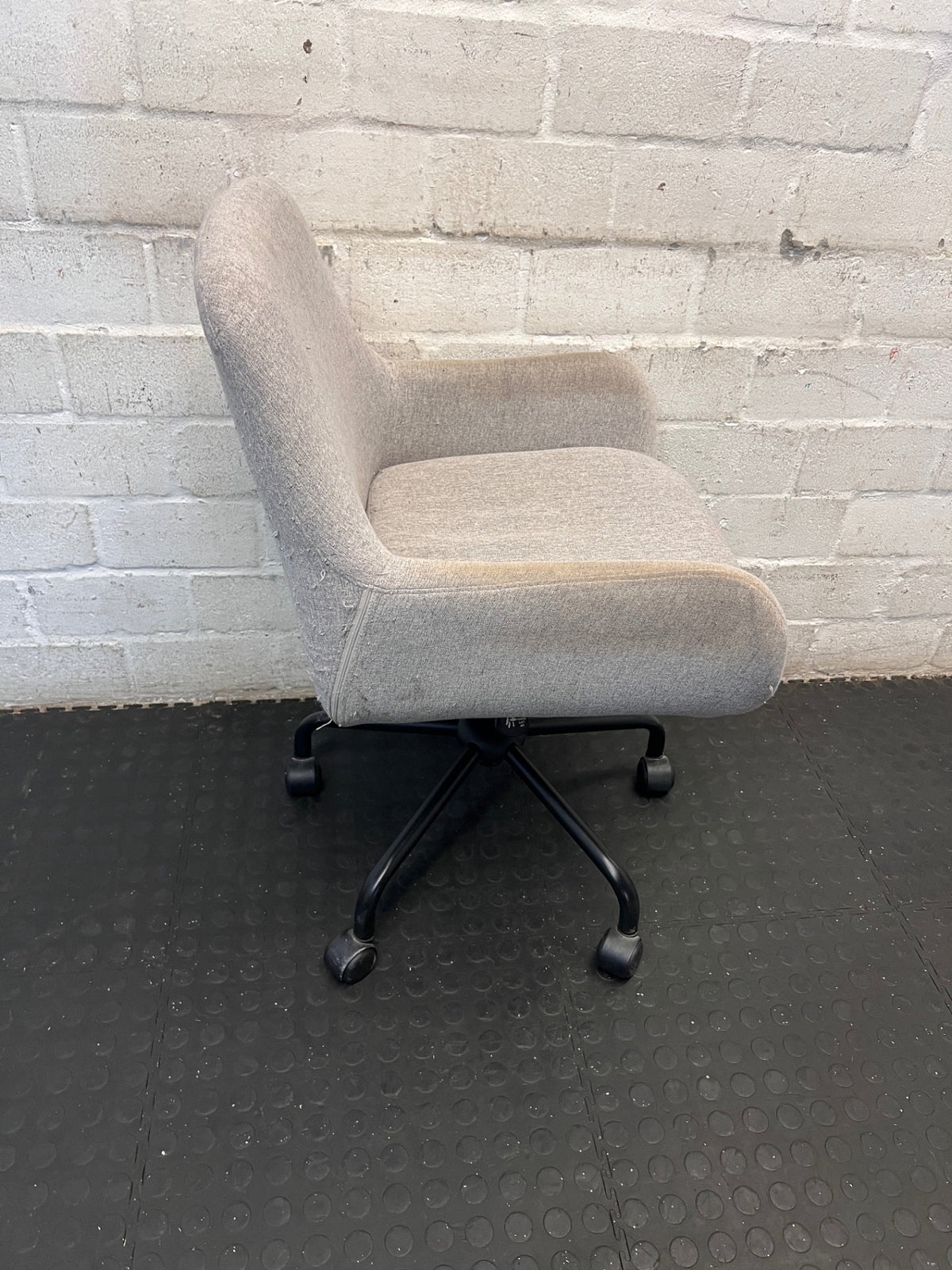 Grey Fabric Office Chair with Black Swivel Base – side view