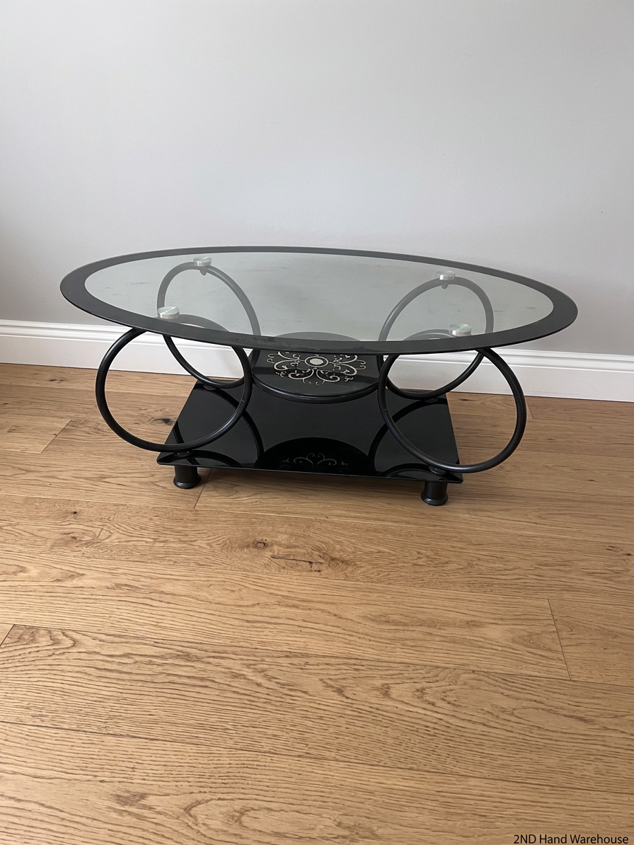 Oval Glass and Black Metal Coffee Table with Filigree Detail – styled product image