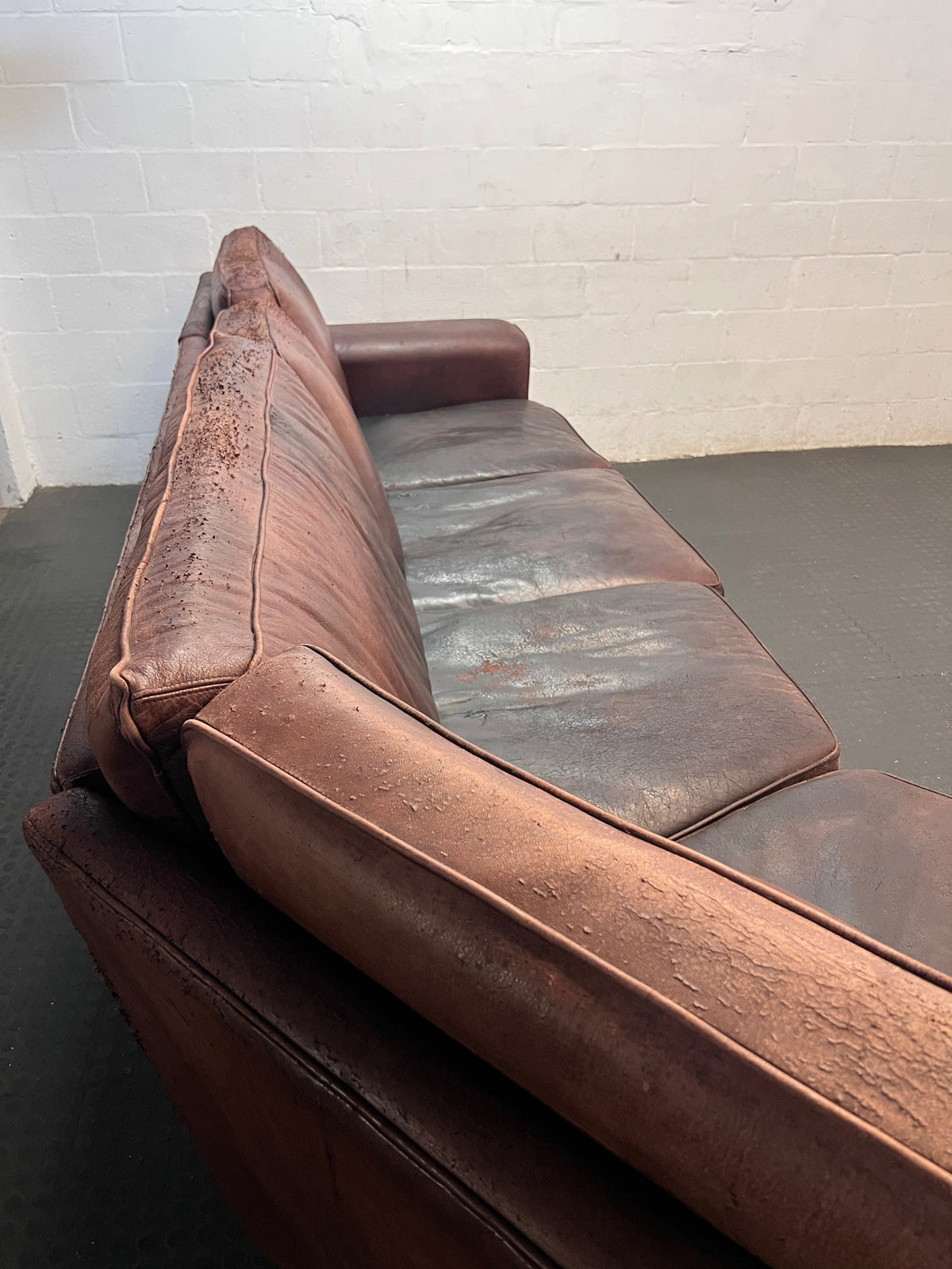 Large Brown Leather Corner Couch — Damaged Leather Upholstery – back view