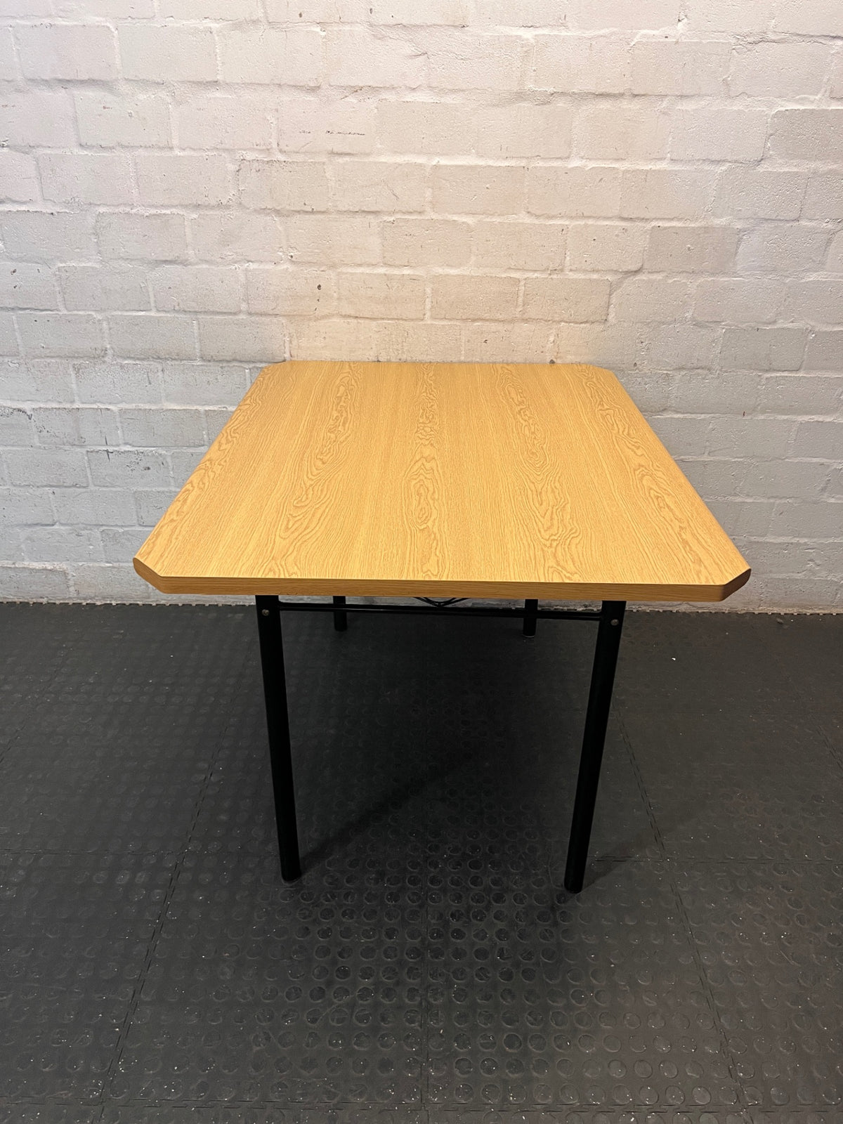 Oak Tone Dining Table with Black Metal Legs – back view