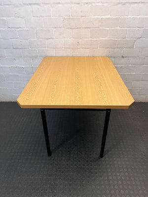 Oak Tone Dining Table with Black Metal Legs – side view