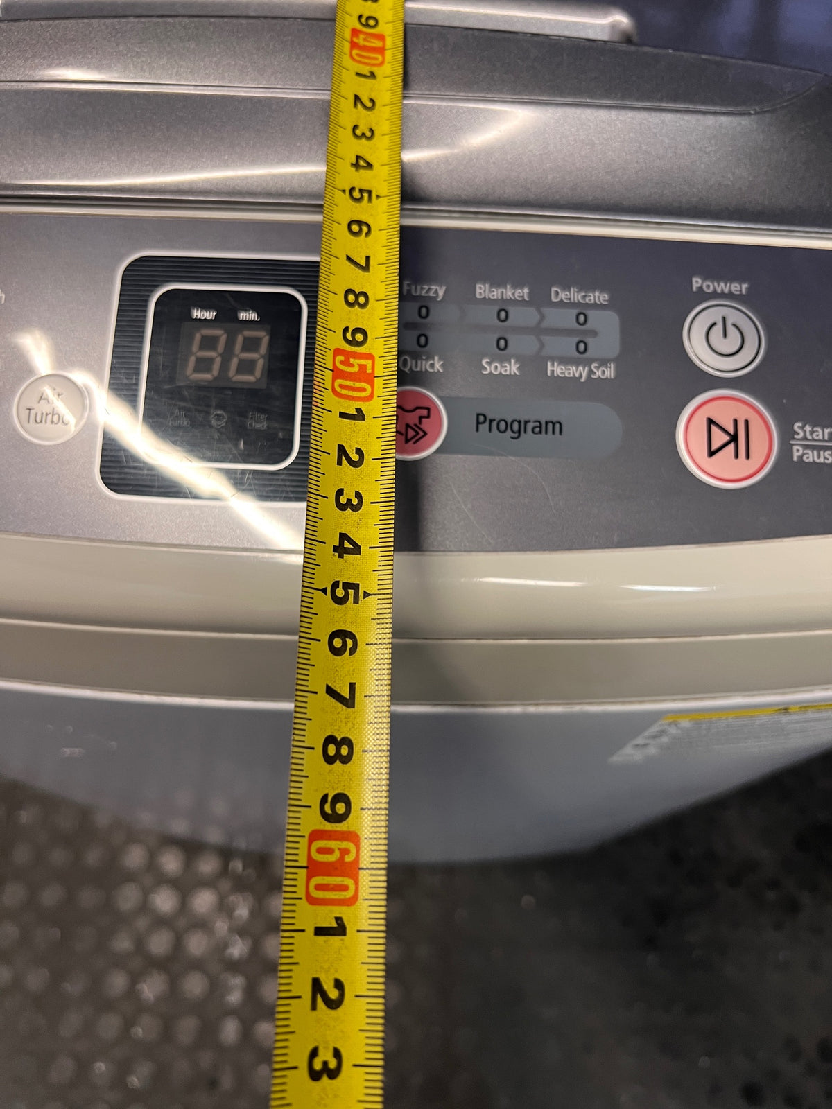 White Top-Loader Washing Machine with Digital Display – depth measurement