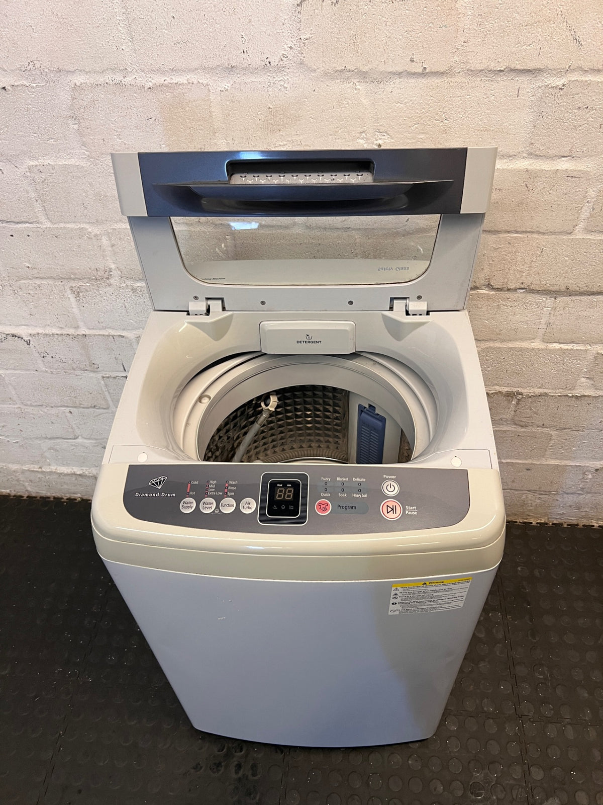 White Top-Loader Washing Machine with Digital Display – side view