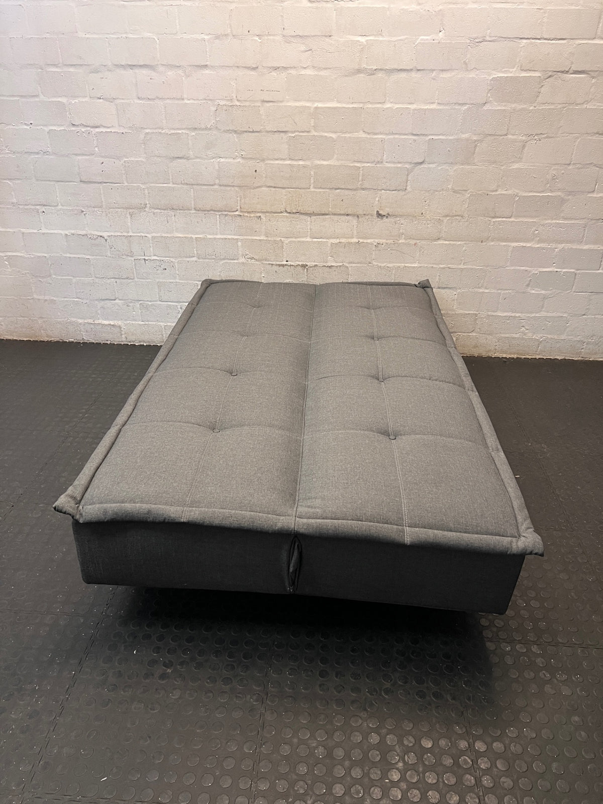 Grey Fabric Armless Sleeper Couch – back view