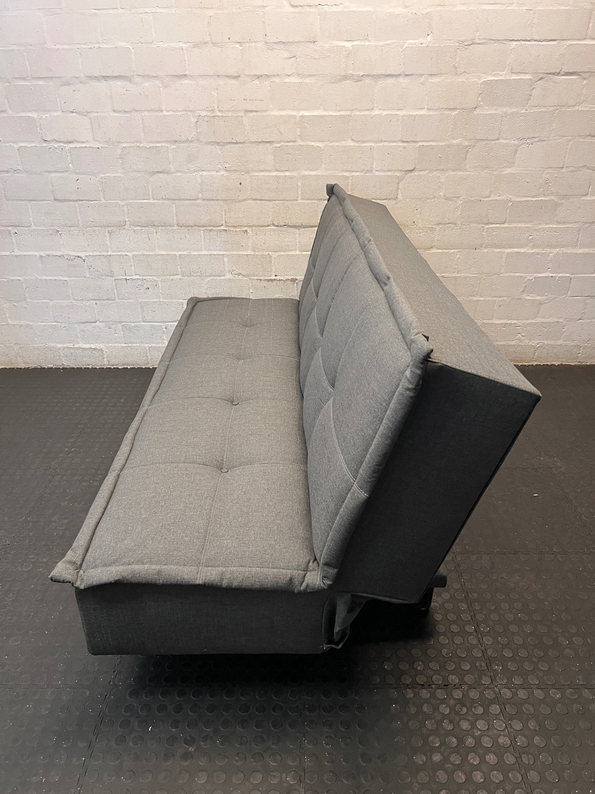 Grey Fabric Armless Sleeper Couch – side view
