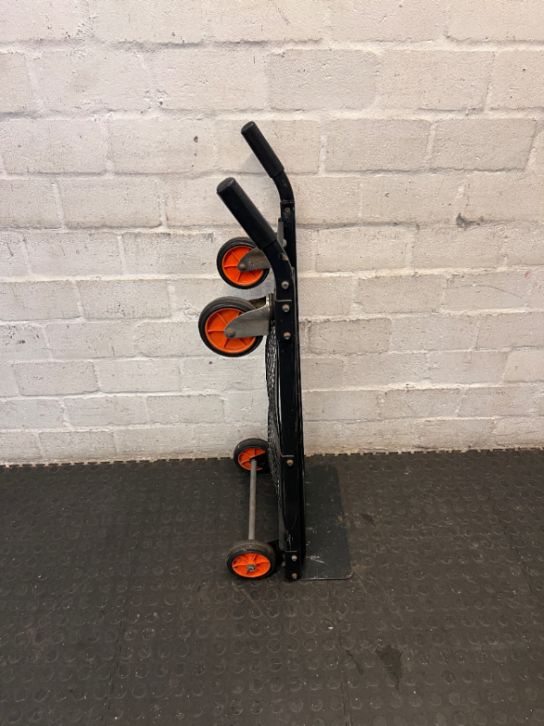Black Metal Platform Trolley with Mesh Base — Fair Used Condition with Visible Wear