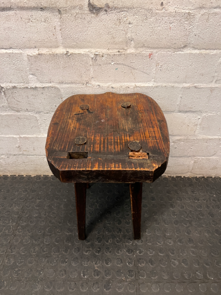 Rustic Hand-Carved Three-Legged Wooden Stool