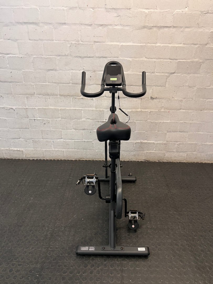 Trojan Spin 120 Exercise Bike in Dark Grey — Good Working Order; Missing Sticker on Wheel