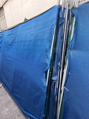 Blue shade-cloth fence divider panel front