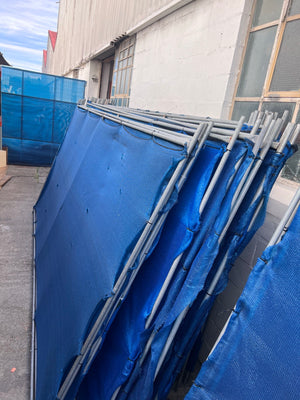 Blue shade-cloth fence divider panels