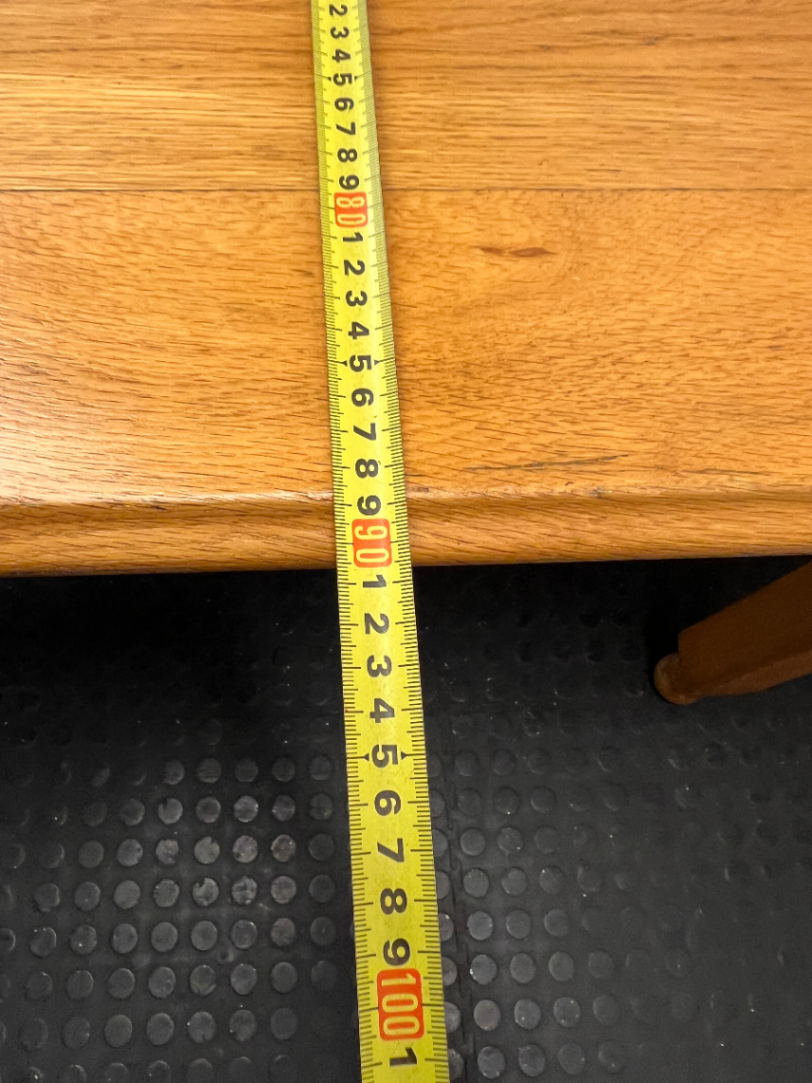 Wooden Dining Table with Rounded Corners and Bun Feet — Well Used with Scratches and Fading on Seats