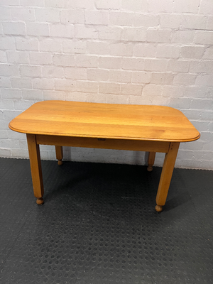 Wooden Dining Table with Rounded Corners and Bun Feet — Well Used with Scratches and Fading on Seats