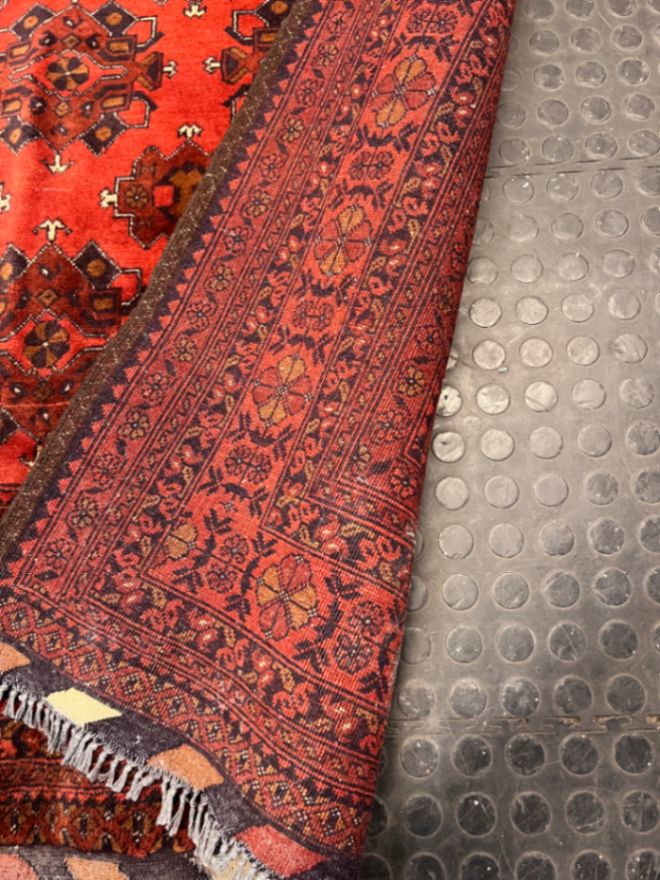 Intricate Red Persian Style Fringed Rug — Fair-Used Condition