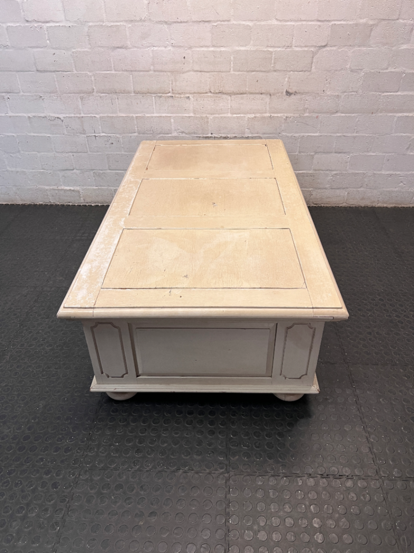 Cream Panelled Wood Coffee Table with Bun Feet — Visible Wear and Paint Chipping