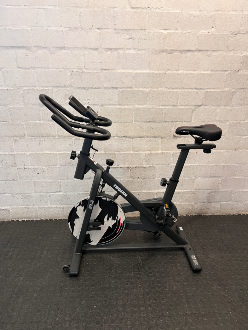 Trojan Spin 120 Exercise Bike in Dark Grey — Good Working Order; Missing Sticker on Wheel