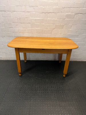 Wooden Dining Table with Rounded Corners and Bun Feet — Well Used with Scratches and Fading on Seats