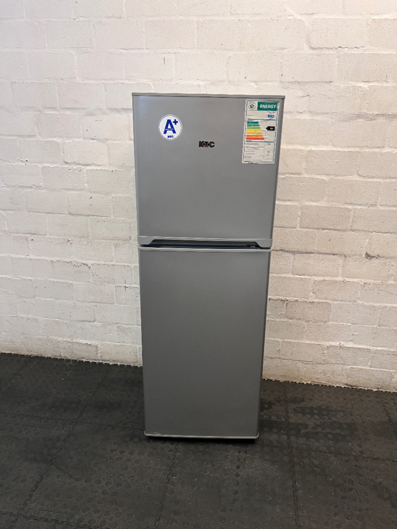 KIC Top-Mount Fridge Freezer in Silver — Working Order with Chipped Door Shelf