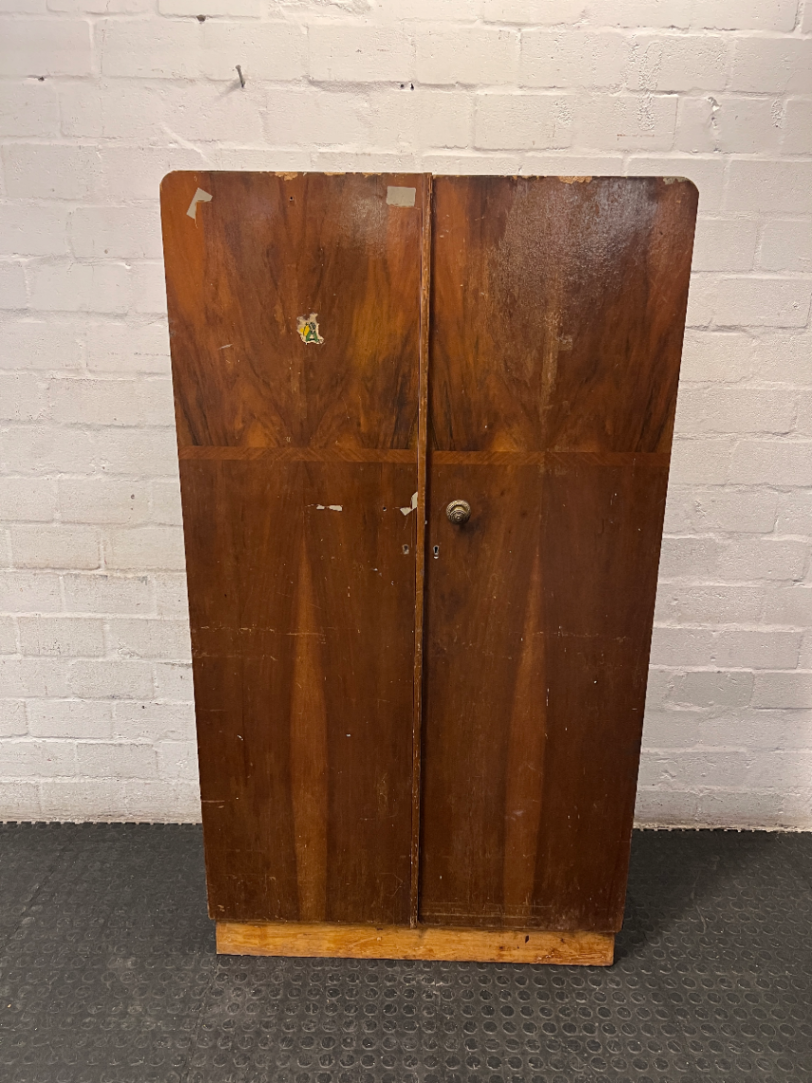 Vintage Dark Wood Two-Door Cupboard — Vintage Condition with Surface Wear and Stickers
