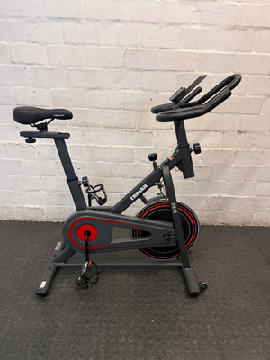 Trojan Spin 120 Exercise Bike in Dark Grey — Good Working Order; Missing Sticker on Wheel