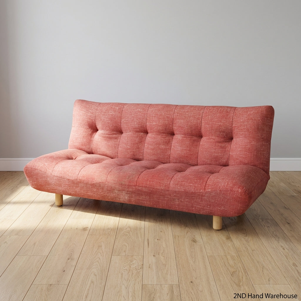 Compact Coral Tufted Sofa / sleeper couch slight tear on materiel at the bottom - 2ndhandwarehouse.com