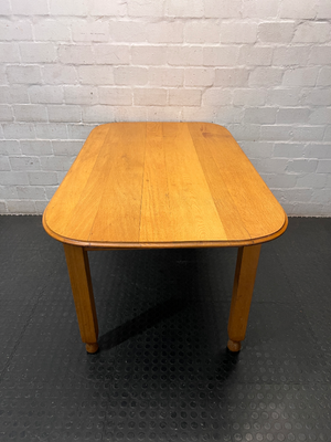 Wooden Dining Table with Rounded Corners and Bun Feet — Well Used with Scratches and Fading on Seats