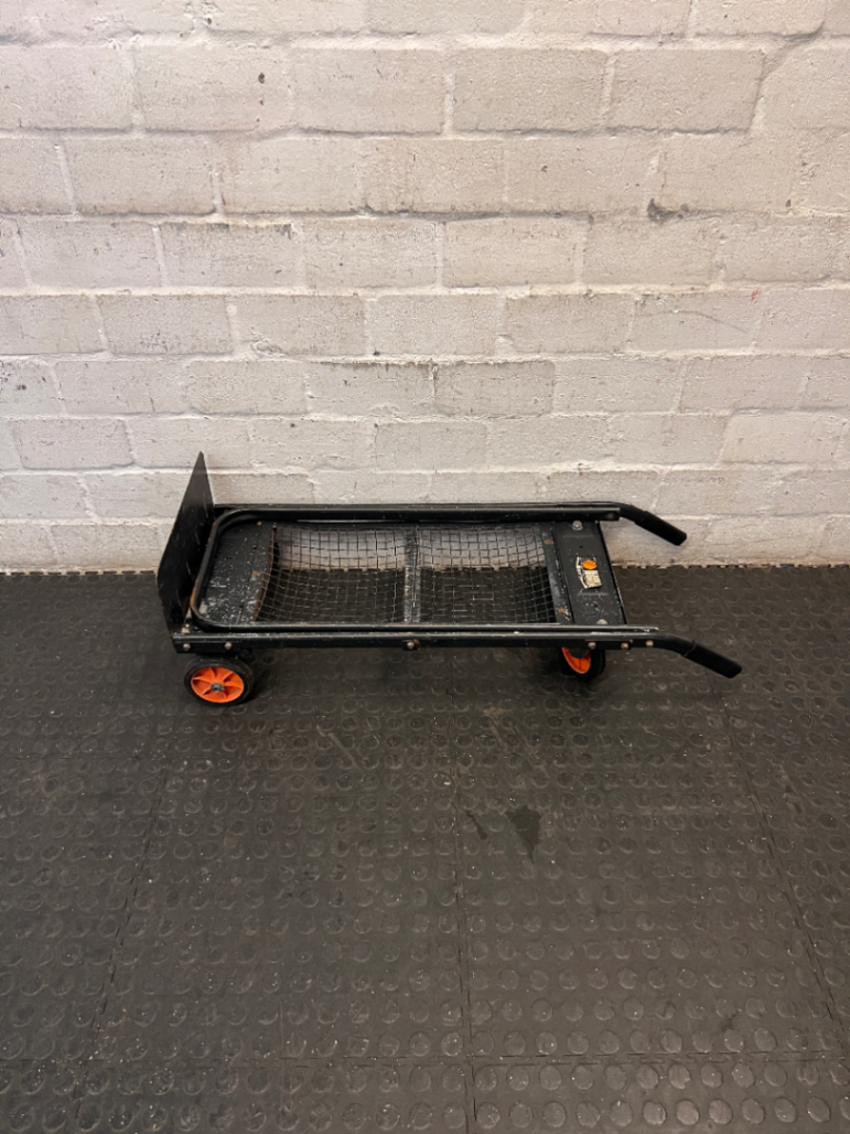 Black Metal Platform Trolley with Mesh Base — Fair Used Condition with Visible Wear