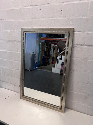 Rectangular Silver-Toned Mirror with Ornate Frame Detail