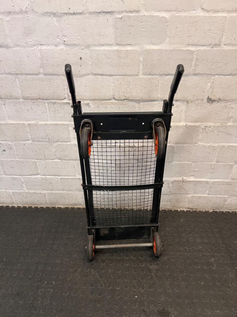 Black Metal Platform Trolley with Mesh Base — Fair Used Condition with Visible Wear
