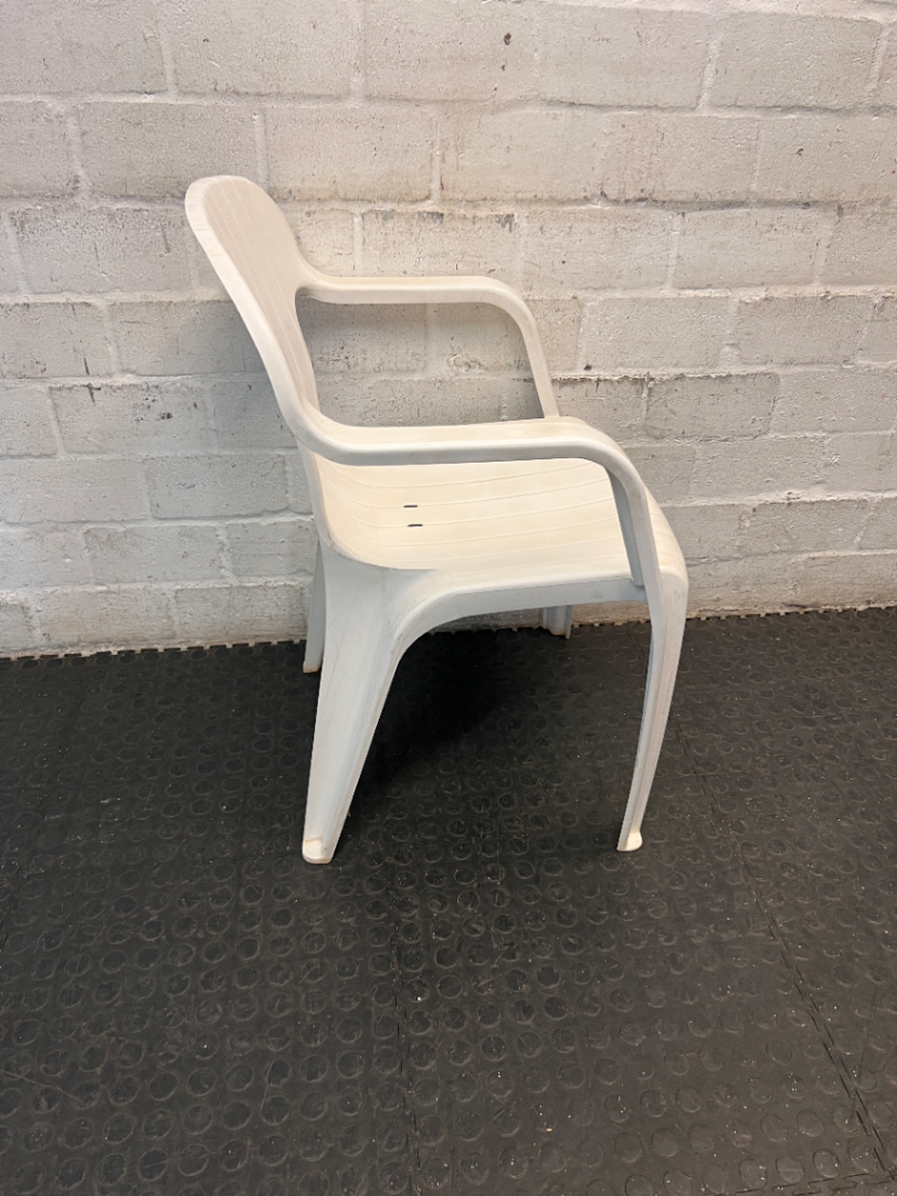 White Moulded Plastic Outdoor Armchair — Surface Wear and Cracks