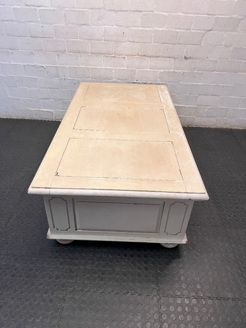 Cream Panelled Wood Coffee Table with Bun Feet — Visible Wear and Paint Chipping