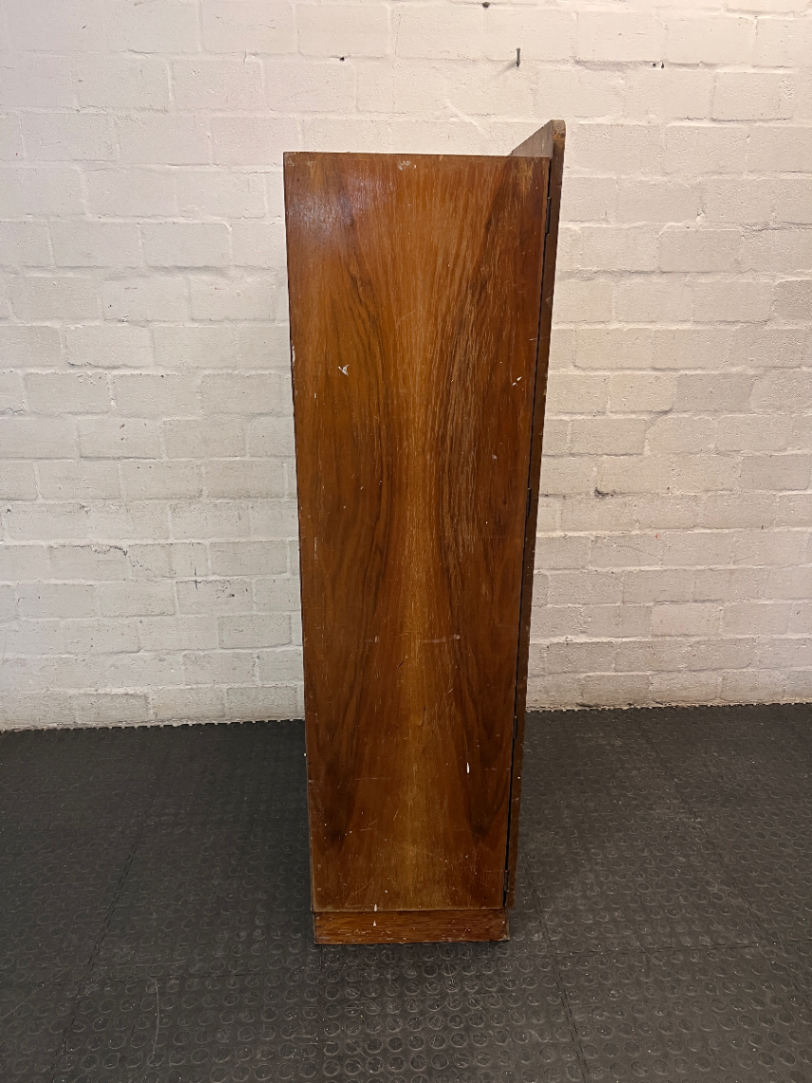 Vintage Dark Wood Two-Door Cupboard — Vintage Condition with Surface Wear and Stickers