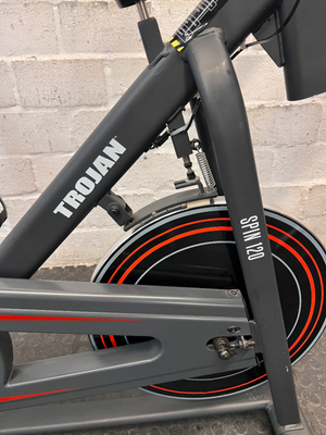 Trojan Spin 120 Exercise Bike in Dark Grey — Good Working Order; Missing Sticker on Wheel
