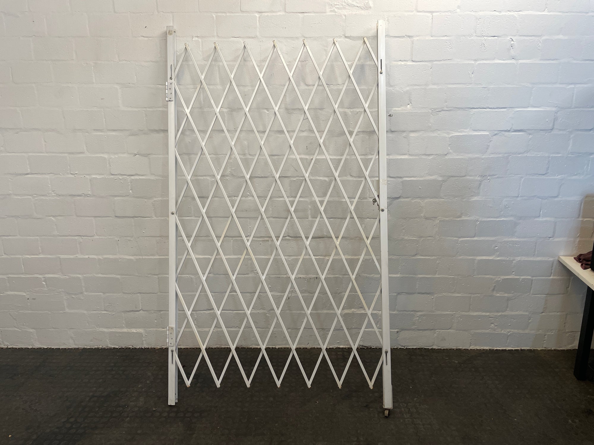 White Steel Folding Security Gate